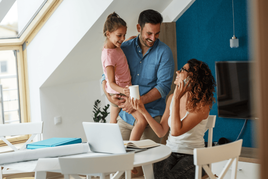 Family talking and happy in a beautifully painted living room with vibrant wall colours.